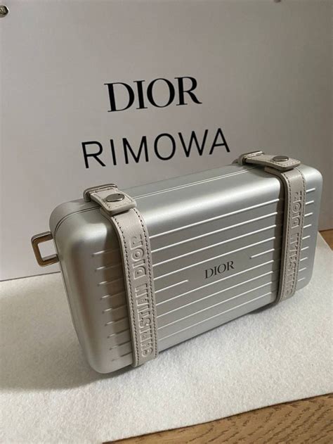 dior x rimova|Dior x Rimowa clutch.